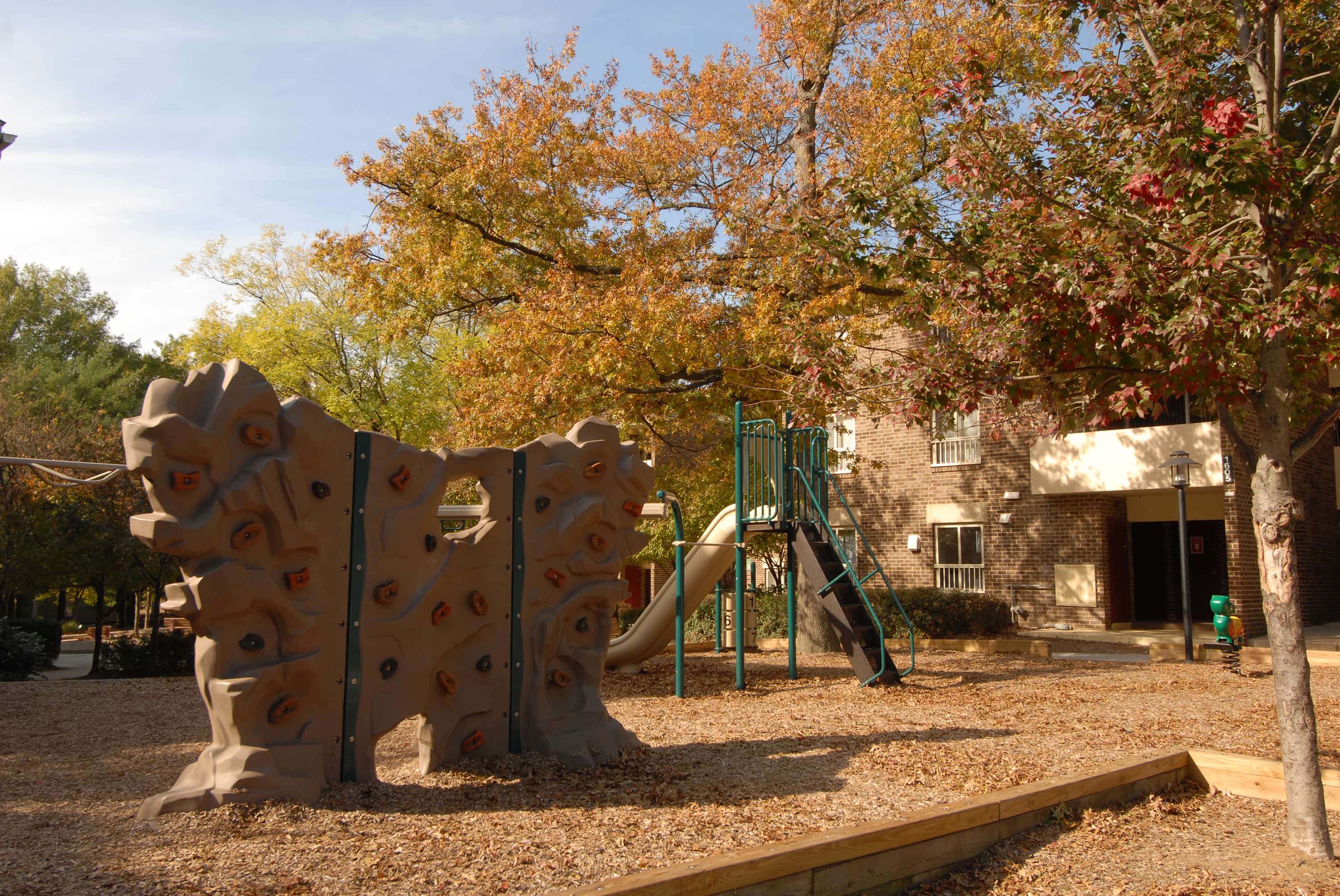 A playground outside of an apartment community
